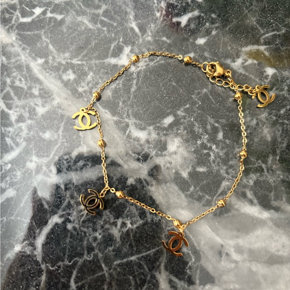 CHANEL Gold Logo Charm Bracelet